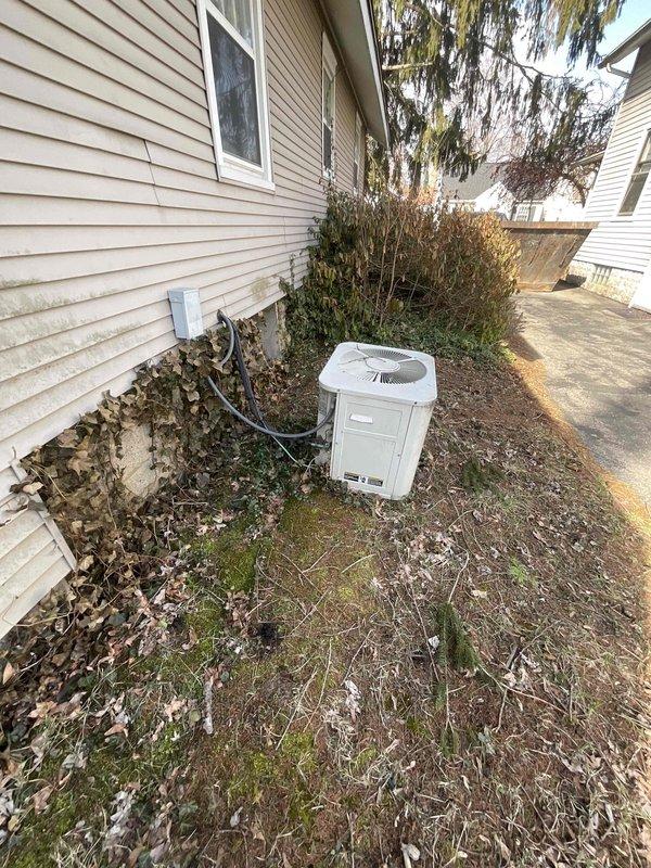 Conducted comprehensive site evaluation for complete HVAC system replacement including furnace and air conditioning unit. Current equipment is operational but aged beyond recommended service life, with furnace located in basement and outdoor condensing unit positioned in side yard. Documented existing electrical service entrance configuration, outdoor unit placement, and accessibility conditions to develop accurate replacement specifications and installation requirements.