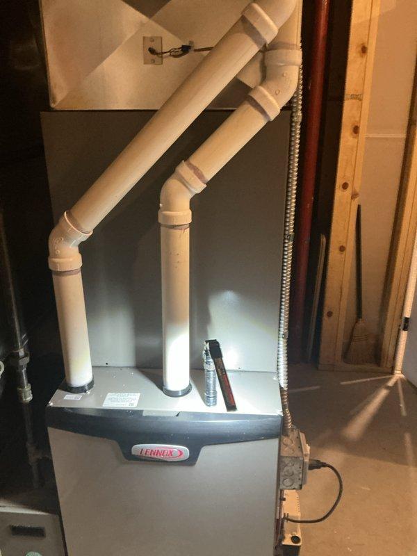 Completed comprehensive 5-year recurring maintenance service on Lennox high-efficiency furnace system. Performed thorough inspection of unit including blower assembly, heat exchanger, and dual-pipe PVC venting configuration. Cleaned and evaluated all internal components, verified proper drainage, and confirmed all electrical connections and safety controls were functioning within manufacturer specifications. System tested and operating efficiently with no issues identified.