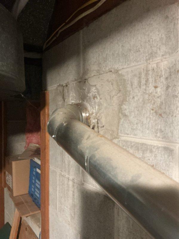 # Tanked Water Heater Service

Responded to service call for a 14-year-old Bradford White tanked water heater located in basement utility area. Performed diagnostic inspection of unit including evaluation of all plumbing connections, pressure relief valve, discharge piping, and copper supply lines. Documented existing conditions with photography showing water heater installation, piping configuration with color-coded tape markings, and digital control unit mounted on top of tank.

Inspected galvanized vent pipe penetration through concrete block wall, noting significant white mineral deposits and crystalline buildup around wall penetration point, indicating potential moisture or condensation issues requiring monitoring. Evaluated all visible plumbing infrastructure, electrical connections, and mechanical components for proper operation and code compliance.

No warranty coverage applicable for parts or labor on this service visit.