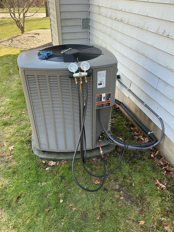 Completed annual cooling maintenance on residential HVAC system. Performed comprehensive inspection of Lennox outdoor condenser unit, checked refrigerant pressures using manifold gauge set, verified proper system operation, and documented equipment condition with photographic records.