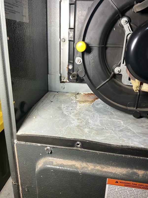 Responded to post-flood furnace inspection request. Performed thorough visual examination of all accessible furnace components including blower assembly, electrical connections, and cabinet interior. Documented evidence of water exposure with visible corrosion on metal surfaces and mineral deposits on base pan. Blower motor and housing showed operational wear but no immediate water damage. All wiring harnesses and electrical connections were inspected for moisture intrusion and found intact. Advised homeowner of observed corrosion and potential future concerns related to flood exposure, recommending continued monitoring of unit performance.