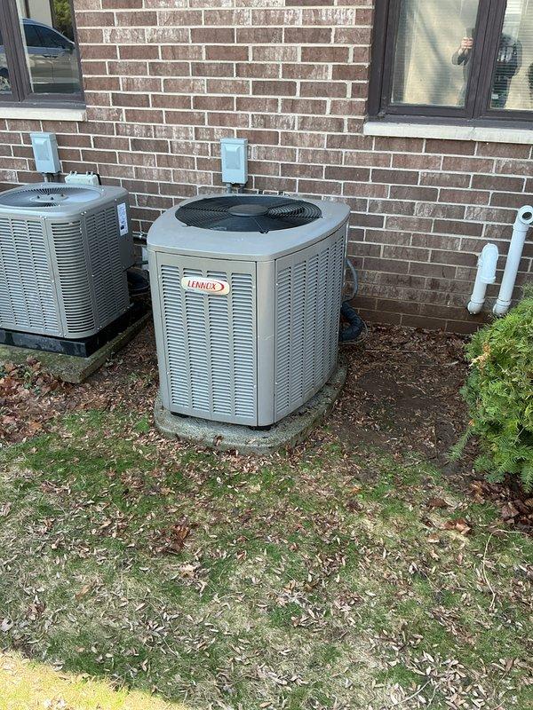 # HVAC Maintenance - ACM Completed

Performed annual cooling maintenance on two Lennox outdoor condensing units located at the rear of the property. Conducted comprehensive inspection of both systems including visual assessment of cabinet condition, refrigerant line connections, and electrical components. Verified proper operation of condenser fan motors and compressors on both units.

Inspected outdoor units for debris accumulation, proper airflow clearance, and potential obstructions around louvered panels. Noted ground conditions around equipment pads showing adequate drainage and stable mounting. Checked electrical disconnect boxes mounted on exterior wall for proper function and secure connections.

Documented current filter specifications requiring HCF16-11 (MERV 11) replacement. Photographed equipment condition and positioning for maintenance records. Both Lennox units showed normal wear patterns consistent with regular operation. All accessible components inspected and found to