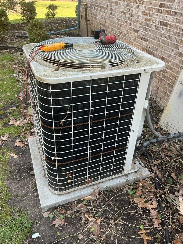 Completed annual cooling maintenance on outdoor heat pump unit. Performed comprehensive system inspection including visual assessment of cabinet condition, coil cleanliness, and refrigerant line connections. Unit showed signs of normal weathering with minor rust staining on frame and debris accumulation around base. Conducted diagnostic testing with electrical meters to verify proper system operation and performance parameters. All components functioning within manufacturer specifications at time of service.