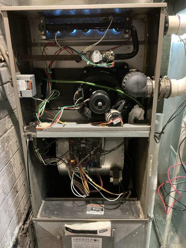 Performed comprehensive annual heating check and tune-up on residential gas furnace system. Conducted thorough inspection of all internal components including heat exchanger, burner assembly, blower motor, gas valve, ignition system, and electrical connections. Verified proper burner operation with clean blue flame pattern across all ports. Tested and confirmed blower motor function, checked all electrical connections and wiring throughout the unit, and inspected control board operation. Cleaned burner assembly and internal components as needed, verified proper airflow, and ensured all safety controls were functioning correctly. System operating efficiently with no issues identified.