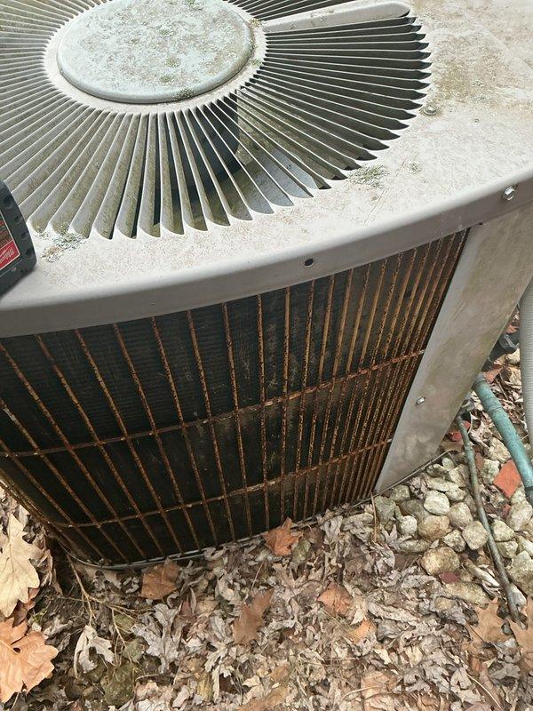 Performed annual preventative maintenance on outdoor air conditioning condenser unit. Inspected condenser coil and fan assembly, noting normal weathering and minor surface oxidation consistent with outdoor exposure. Unit operational with no immediate service concerns identified; documented equipment condition with photographs for maintenance records.