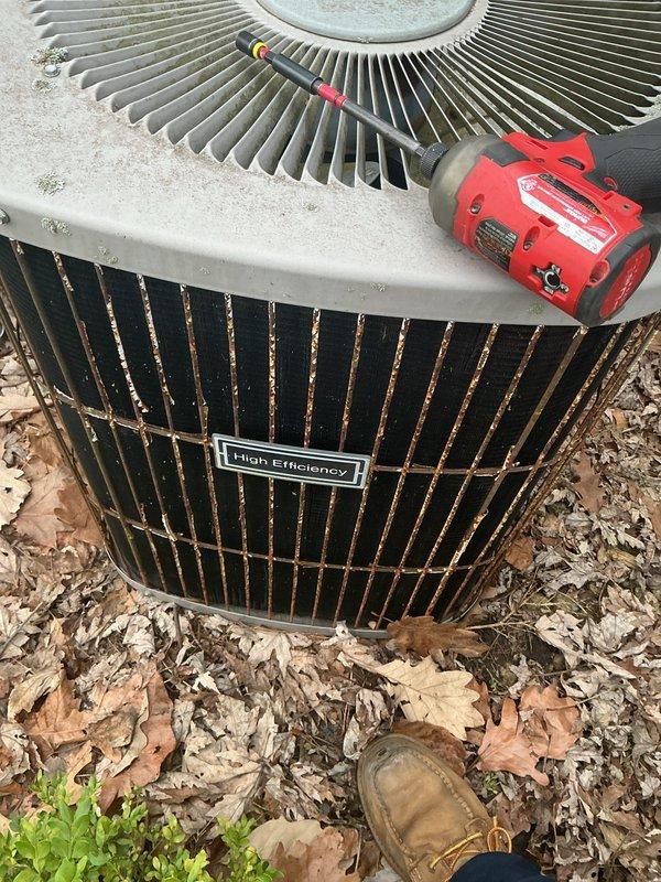 Performed annual preventative maintenance on outdoor air conditioning condenser unit. Inspected condenser coil and fan assembly, noting normal weathering and minor surface oxidation consistent with outdoor exposure. Unit operational with no immediate service concerns identified; documented equipment condition with photographs for maintenance records.