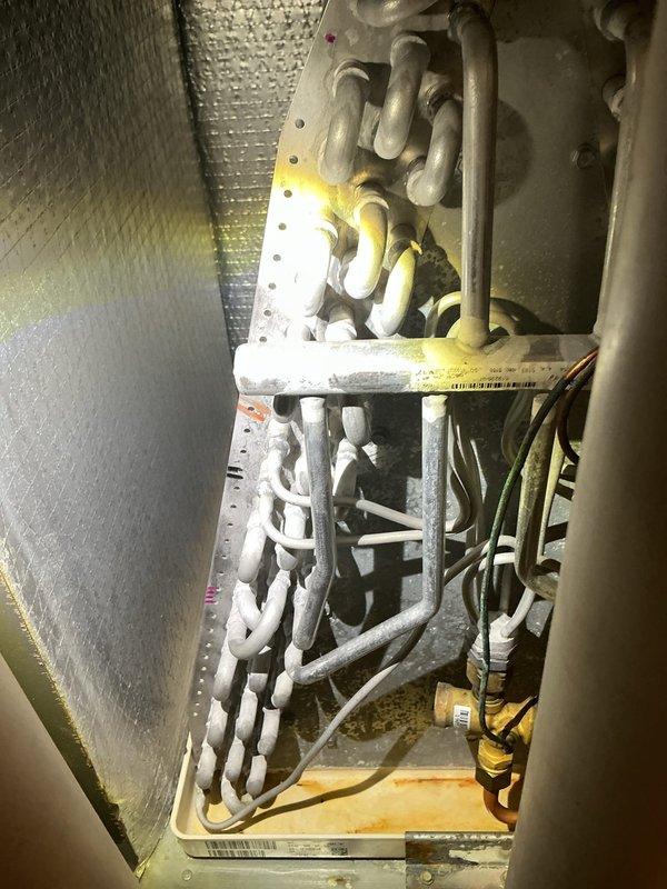 # HVAC Maintenance Summary

Completed annual cooling tune-up on single air conditioning unit as part of ComfortShield Maintenance Package. Performed comprehensive inspection of air handler cabinet, examining evaporator coil assembly, refrigerant lines, electrical connections, and insulation integrity. All components found operating within normal parameters with no refrigerant leaks detected during UV inspection.