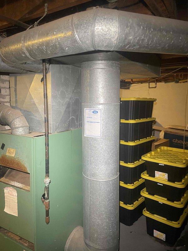 Completed full system estimate for replacement of mid-1980s Bard furnace and new air conditioning installation in single-story residence with approximately 650 square feet and unfinished basement. Assessed existing HVAC equipment including aged furnace unit, evaluated electrical panel capacity for new system requirements, inspected existing ductwork configuration and support structures, documented current system layout with photographic records, and provided comprehensive replacement recommendations for both heating and cooling equipment to meet immediate replacement timeline.