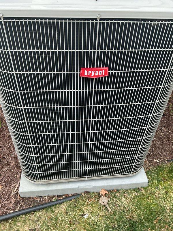 Completed annual cooling maintenance on Bryant outdoor condensing unit. Inspected condenser coil and cabinet, confirmed unit operational condition, documented equipment status with photos, and noted high-efficiency filter replacement required at indoor air handler.