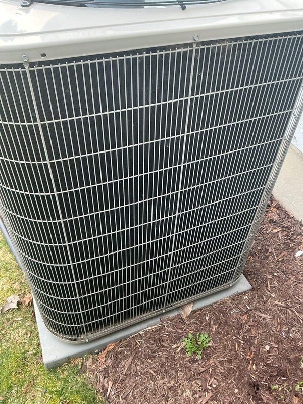 Completed annual cooling maintenance on Bryant outdoor condensing unit. Inspected condenser coil and cabinet, confirmed unit operational condition, documented equipment status with photos, and noted high-efficiency filter replacement required at indoor air handler.