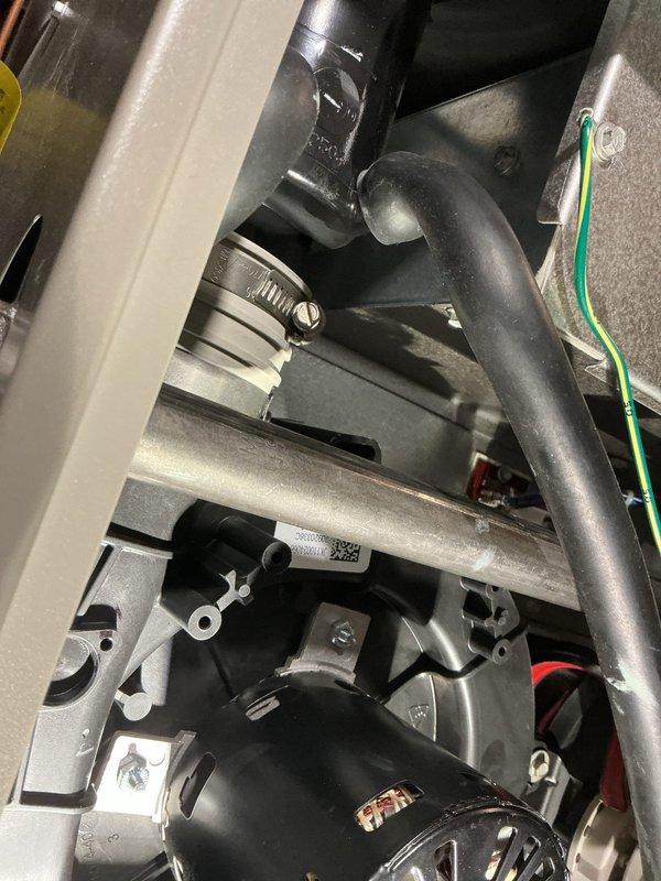 Responded to maintenance appointment where water was discovered in the top of furnace cabinet with visible water staining behind the blower motor. Performed diagnostic inspection of the unit, documenting the condensate system components including the pump assembly, drain lines, and evaporator coil. Identified moisture intrusion issue requiring further evaluation and scheduled follow-up service appointment to complete necessary repairs.