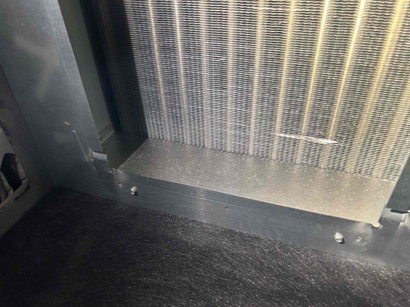 Responded to maintenance appointment where water was discovered in the top of furnace cabinet with visible water staining behind the blower motor. Performed diagnostic inspection of the unit, documenting the condensate system components including the pump assembly, drain lines, and evaporator coil. Identified moisture intrusion issue requiring further evaluation and scheduled follow-up service appointment to complete necessary repairs.