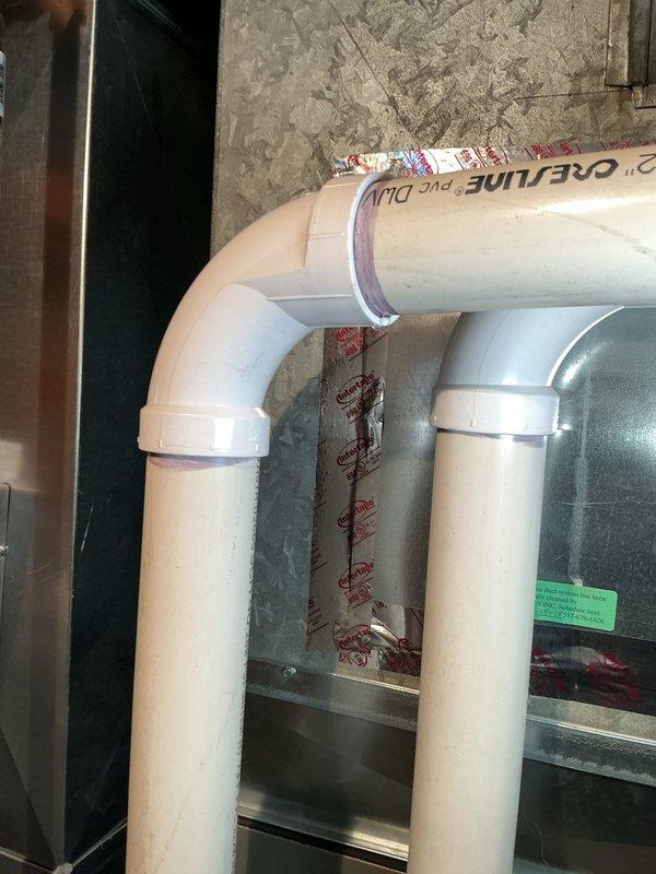 During a scheduled maintenance appointment, a water leak was discovered on the furnace exhaust vent pipe. The leak was identified at the PVC piping configuration, and necessary repairs were completed with replacement parts and labor to restore proper system operation and prevent further water damage.