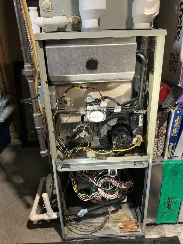 Responded to no-heat call on 8-year-old Trane furnace (model 7UH25064MX5VAA) located in basement. Performed diagnostic evaluation of unit with access panel removed, inspecting draft inducer motor assembly, blower motor, heat exchanger, electrical connections, and control wiring harnesses. Identified issue preventing unit operation, completed necessary repairs to restore heating function, and verified proper system operation before closing service call.