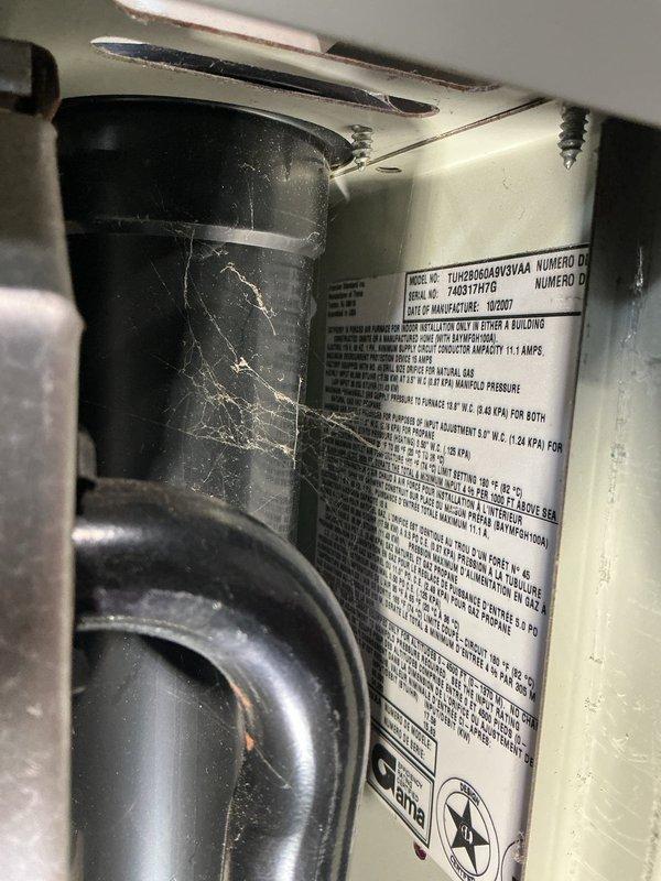 Responded to no-heat call on 8-year-old Trane furnace (model 7UH25064MX5VAA) located in basement. Performed diagnostic evaluation of unit with access panel removed, inspecting draft inducer motor assembly, blower motor, heat exchanger, electrical connections, and control wiring harnesses. Identified issue preventing unit operation, completed necessary repairs to restore heating function, and verified proper system operation before closing service call.