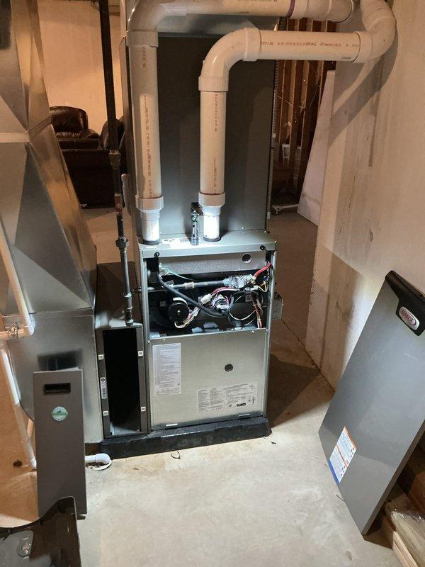 Completed annual HVAC maintenance on Lennox gas furnace system. Replaced air filter and evaporator coil pad, inspected all mechanical components with access panel removed, and verified proper operation of blower motor and controls. Checked PVC intake and exhaust venting connections and confirmed system functionality.