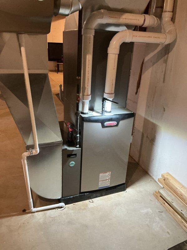 Completed annual HVAC maintenance on Lennox gas furnace system. Replaced air filter and evaporator coil pad, inspected all mechanical components with access panel removed, and verified proper operation of blower motor and controls. Checked PVC intake and exhaust venting connections and confirmed system functionality.