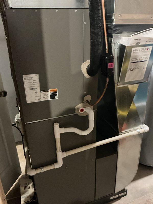 Completed annual cooling maintenance visit on residential HVAC system. Performed comprehensive inspection of air handler unit, verified proper operation of humidifier assembly and pad condition, and checked refrigerant lines and condensate drainage system. All components found operating within normal parameters, with humidifier pad showing acceptable wear and mineral deposits consistent with regular use.