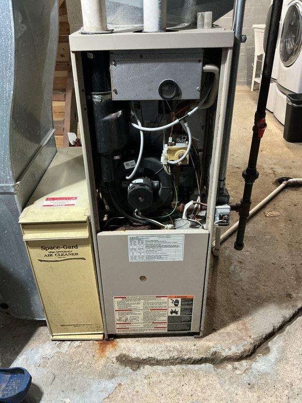 Completed comprehensive tune-up and preventative inspection on 28-year-old forced air furnace and central air conditioning system for new homeowner. Performed full system evaluation including blower motor assembly inspection, electrical connections verification, air filter housing assessment, and operational safety checks on both heating and cooling equipment. All components found to be functional with typical age-related wear; systems operating within acceptable parameters at time of inspection.