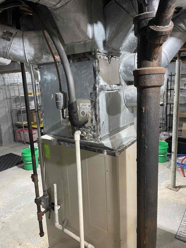 Provided comprehensive estimate for replacement of 27-year-old furnace and air conditioning system located in basement. Current equipment is operational but has reached end of serviceable life based on age and condition observed during evaluation. Documented existing installation including ductwork configuration, electrical connections, PVC condensate drainage, and gas piping for replacement specifications.