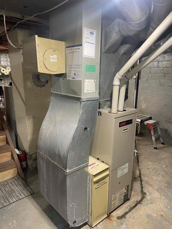 Provided comprehensive estimate for replacement of 27-year-old furnace and air conditioning system located in basement. Current equipment is operational but has reached end of serviceable life based on age and condition observed during evaluation. Documented existing installation including ductwork configuration, electrical connections, PVC condensate drainage, and gas piping for replacement specifications.