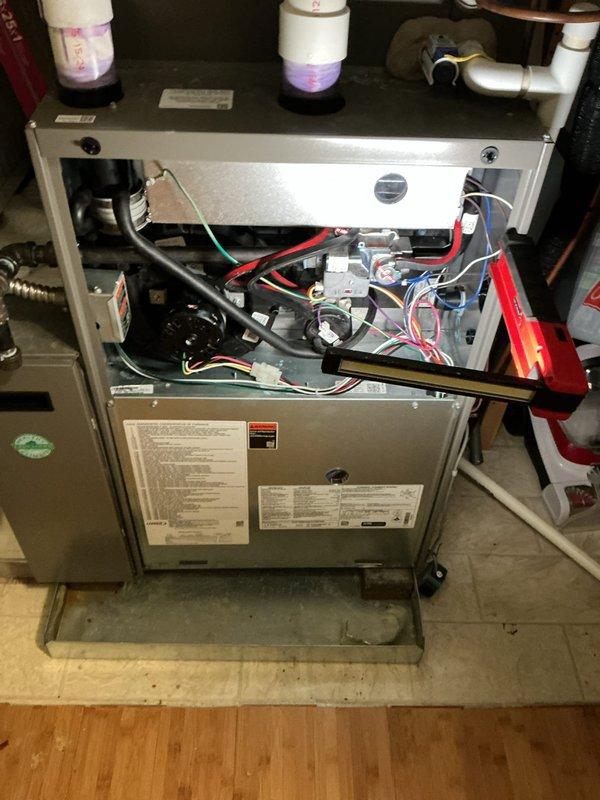 Returned to site to complete warranty work on Lennox furnace unit. Replaced defective heat exchanger with new 11x42 unit per manufacturer specifications. Corrected improper condensate drain pitch to ensure proper drainage and prevent future water backup issues. Removed front access panel to access internal components and performed complete heat exchanger replacement. Verified all electrical connections, wiring harnesses, and control boards were properly secured following installation. Adjusted PVC venting system as needed to accommodate new heat exchanger. Tested unit operation to confirm proper function of blower motor assembly and all mechanical components. Documented installation with photos showing completed work and proper component placement. Work completed under purchase order and manufacturer warranty guidelines.