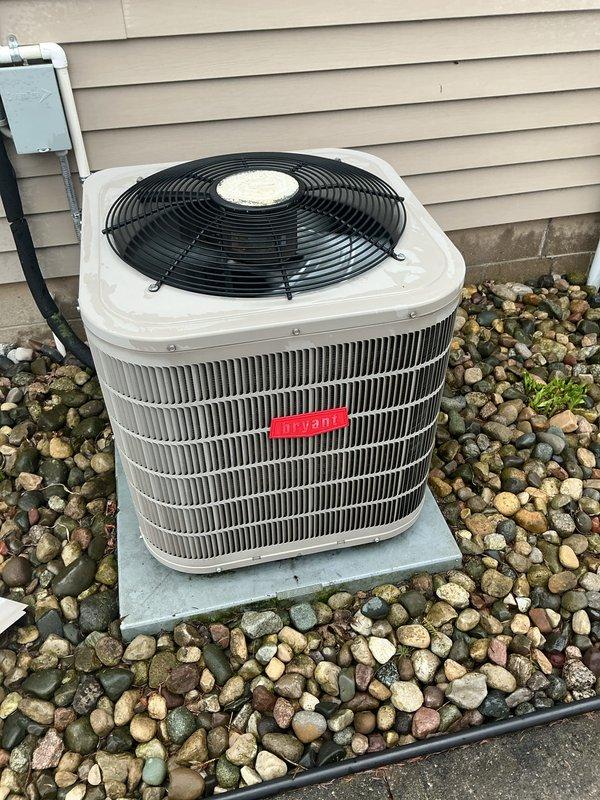 Completed routine maintenance on a 7-year-old central air conditioning system. Performed comprehensive tune-up including inspection of outdoor condensing unit, verified proper operation of compressor and condenser fan, checked refrigerant lines and electrical connections at disconnect box, cleaned condenser coils, and confirmed system is cooling effectively. Unit found in good working condition with no issues identified during service visit.