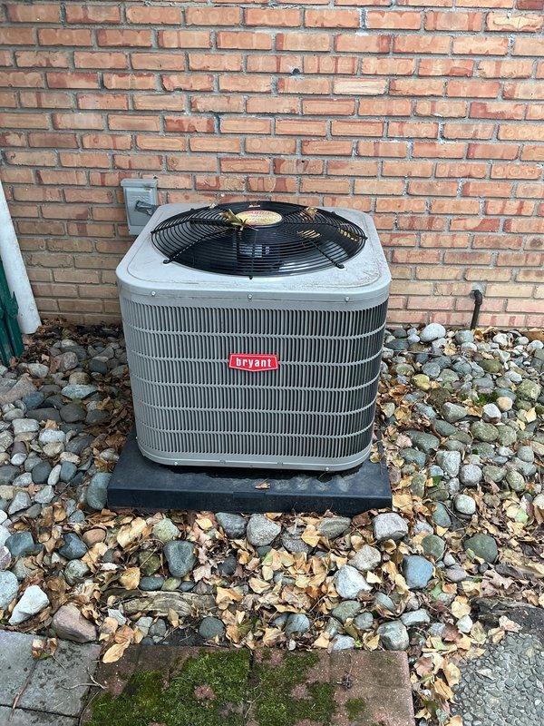 Completed annual preventative maintenance on Bryant central air conditioning system. Performed comprehensive tune-up including inspection of condenser unit, electrical connections at disconnect box, refrigerant levels, and overall system operation. Cleaned condenser coils, checked fan motor operation, verified proper airflow through top-mounted fan assembly, and confirmed unit is cycling correctly. All components found in good working condition with no repairs needed at this time. System operating within manufacturer specifications and ready for upcoming cooling season.