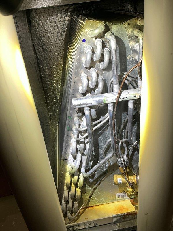 Completed annual cooling maintenance on Lennox model C33-30B-6P-20 air handler system. Inspected evaporator coil assembly, verified refrigerant lines and connections, documented system specifications and manufacturer labeling, and confirmed all components operational for the cooling season.
