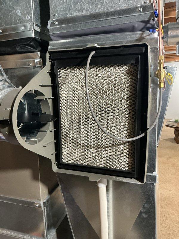 Performed routine air handler maintenance including inspection and filter replacement. Filter showed moderate dust accumulation with visible spotting; installed new filter with proper orientation and secured access panel. Inspected associated condensate pump assembly and PVC drain lines in attic space; confirmed proper operation and verified all connections were secure with no signs of leakage or blockage.