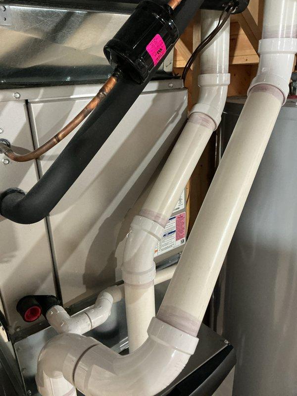 Performed routine air handler maintenance including inspection and filter replacement. Filter showed moderate dust accumulation with visible spotting; installed new filter with proper orientation and secured access panel. Inspected associated condensate pump assembly and PVC drain lines in attic space; confirmed proper operation and verified all connections were secure with no signs of leakage or blockage.