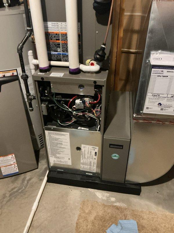 Completed routine maintenance on both forced air furnace and air conditioning system, both less than one year old. Performed comprehensive AC tune-up including inspection of outdoor condenser unit, verified proper operation of fan motor and compressor, checked refrigerant levels, and cleaned condenser coils. Inspected indoor furnace components with access panel removed, examined electrical connections, wiring, and internal mechanical systems. Verified proper operation of all PVC condensate drain lines and associated pumps. Both systems found to be operating within normal parameters with no deficiencies noted. All equipment confirmed in excellent condition appropriate for age of units.