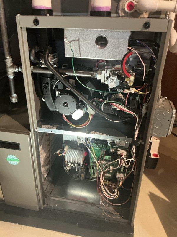 Performed complimentary preventative maintenance inspection on Lennox furnace and air conditioning system. Accessed interior components, inspected blower motor assembly, circuit board, heat exchanger, electrical connections, and verified all wiring and safety controls were functioning properly. All systems operational with no issues found.