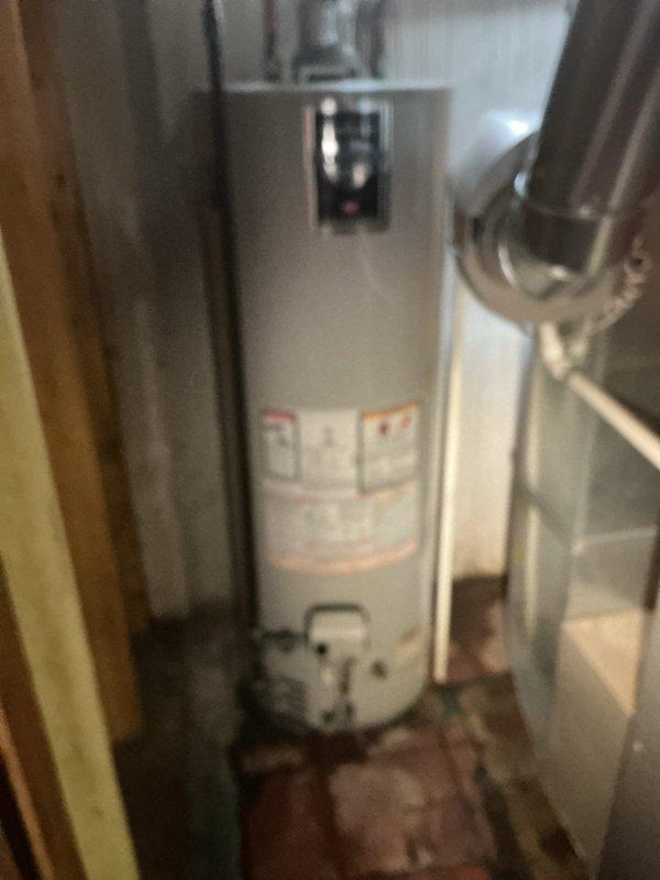 Responded to warranty service call for water heater installed under 10/10 warranty program reporting leak from tube or fitting. Upon inspection, determined unit could not be repaired and required full replacement per warranty terms. Removed existing failed water heater and installed new residential tanked water heater unit in basement utility area. Connected all supply and discharge piping, verified proper venting, tested all connections for leaks, and confirmed unit operational with proper temperature settings.