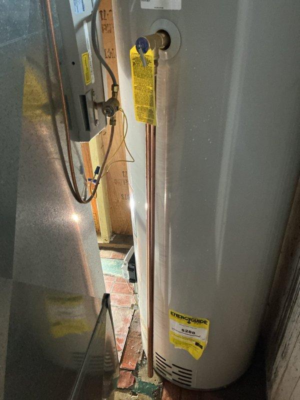 Responded to warranty service call for water heater installed under 10/10 warranty program reporting leak from tube or fitting. Upon inspection, determined unit could not be repaired and required full replacement per warranty terms. Removed existing failed water heater and installed new residential tanked water heater unit in basement utility area. Connected all supply and discharge piping, verified proper venting, tested all connections for leaks, and confirmed unit operational with proper temperature settings.