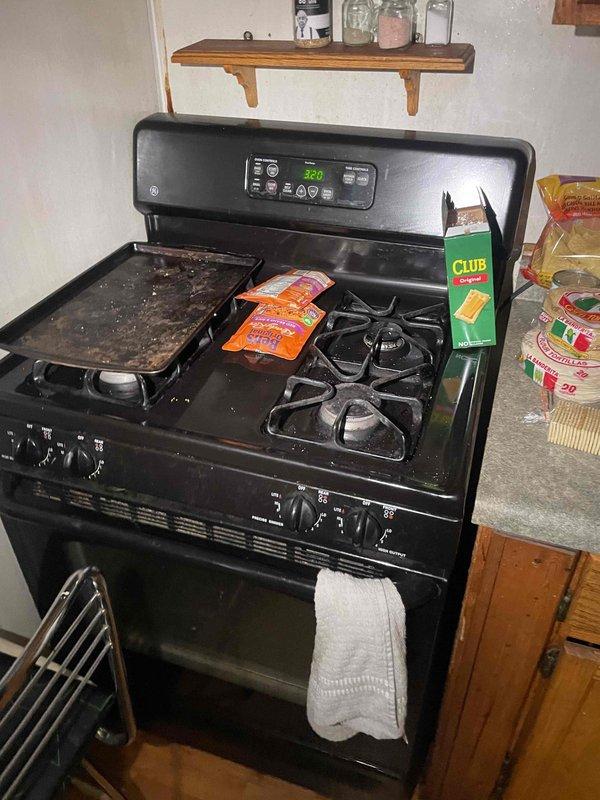 Conducted comprehensive site assessment for full HVAC system replacement and new whole home Generac generator installation. Evaluated existing non-functional air conditioning system, assessed furnace replacement requirements, and documented current gas meter location and configuration for generator integration planning. Photographed gas service infrastructure at exterior meter location and confirmed natural gas appliance compatibility with existing kitchen range to determine proper sizing and load calculations for proposed generator system.