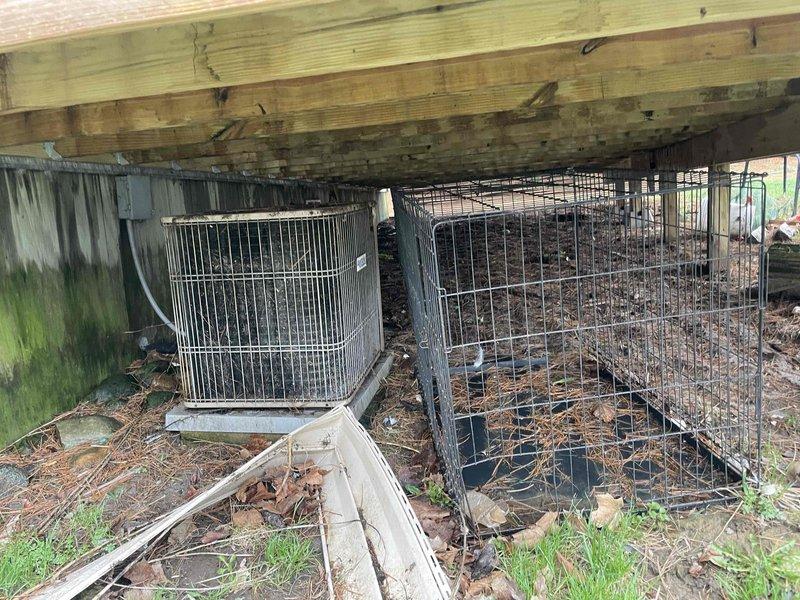 Provided estimate for replacement of non-operational air conditioning system at single-story ranch home. Current outdoor condensing unit dating from 1990s located beneath deck shows significant age-related deterioration and debris accumulation. Indoor air handler/furnace from 2017 housed in main level utility closet with louvered door access remains functional. Estimate covers A/C system replacement only, maintaining existing natural gas furnace equipment.