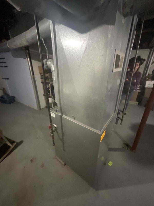 Provided comprehensive estimate for complete air conditioning system installation at residential property with no existing cooling equipment. Evaluated basement mechanical room housing current heating unit, assessed electrical panel capacity and circuit availability, and determined optimal placement for new outdoor condensing unit. Documented existing HVAC infrastructure including ductwork, electrical service, and mechanical room layout to specify equipment requirements and installation scope for new central air conditioning system.
