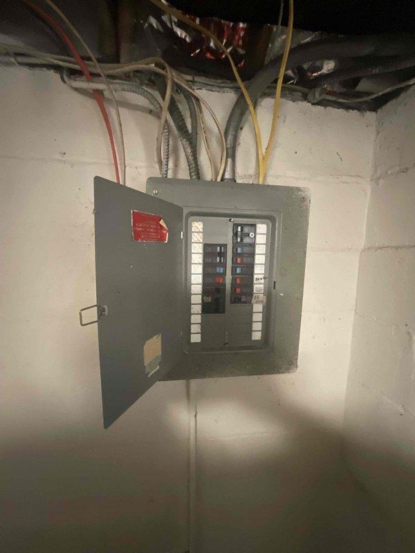 Provided comprehensive estimate for complete air conditioning system installation at residential property with no existing cooling equipment. Evaluated basement mechanical room housing current heating unit, assessed electrical panel capacity and circuit availability, and determined optimal placement for new outdoor condensing unit. Documented existing HVAC infrastructure including ductwork, electrical service, and mechanical room layout to specify equipment requirements and installation scope for new central air conditioning system.