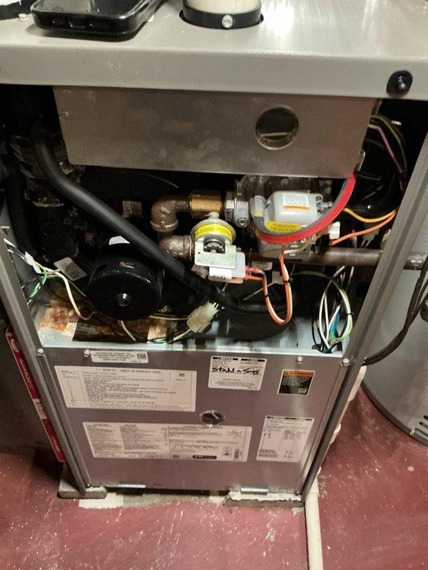 Completed comprehensive maintenance on two furnaces and two air conditioning units. Performed thorough inspection of internal components including heat exchanger, burner assembly, gas valve connections, and electrical wiring. Verified proper operation of all safety controls and measured system voltages, recording 549 millivolts at flame sensor to confirm adequate flame signal. Inspected copper refrigerant lines, condensate drainage system, and all mechanical connections for integrity. All units tested and operating within manufacturer specifications.