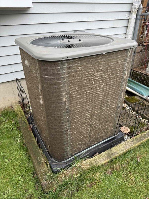 Completed scheduled preventive maintenance on residential HVAC system including both heating and cooling equipment. Performed comprehensive inspection of gas furnace, examining blower motor assembly, electrical connections, and internal components for proper operation. Verified diagnostic system functionality and checked all wire harnesses for secure connections. Inspected outdoor condensing unit, noting weathered exterior panels with accumulated environmental debris and mineral deposits. Replaced air filter and humidifier pad as part of routine maintenance protocol. All equipment operational upon completion of service visit.