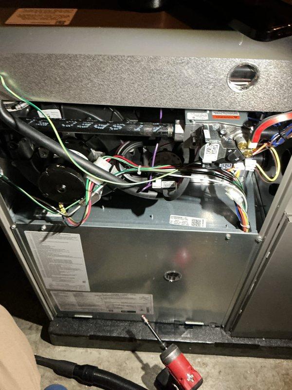 Completed routine maintenance on a one-year-old residential HVAC system including both furnace and air conditioning components. Performed comprehensive AC tune-up with interior inspection of the air handler, verifying all electrical connections, wire harnesses, capacitor function, and blower assembly operation. Conducted exterior condenser unit inspection, confirming proper operation of the fan motor, checking refrigerant levels, and cleaning coils as needed. All system components found operating within normal parameters with no deficiencies noted. Unit tested and left in full working order.