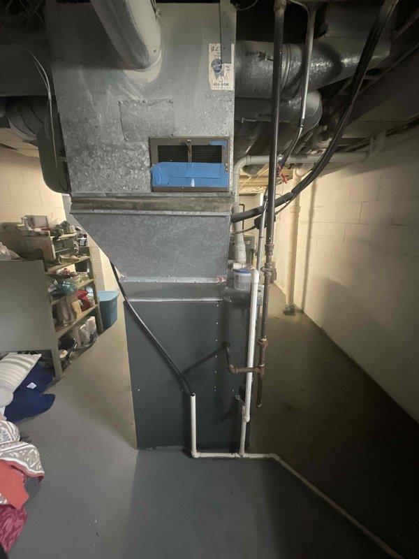 Conducted comprehensive assessment of existing 20-year-old furnace and central air conditioning system for replacement estimate. Evaluated current equipment condition, ductwork configuration, and thermostat setup to provide recommendations for new furnace and split system air conditioning installation. Documented existing system specifications and discussed replacement options with property owner, with anticipated installation timeline within the next six months.