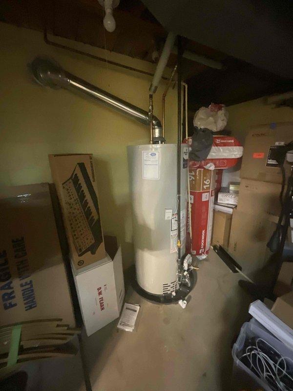 Provided estimate for complete HVAC system replacement in basement location, including natural gas furnace and air conditioning unit under buy-one-get-one promotion. Assessed 18-year-old existing equipment currently non-operational. Evaluated basement utility area with existing water heater, ductwork configuration, and available space for new equipment installation.