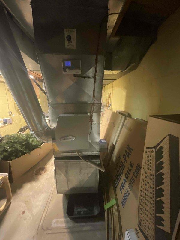 Provided estimate for complete HVAC system replacement in basement location, including natural gas furnace and air conditioning unit under buy-one-get-one promotion. Assessed 18-year-old existing equipment currently non-operational. Evaluated basement utility area with existing water heater, ductwork configuration, and available space for new equipment installation.