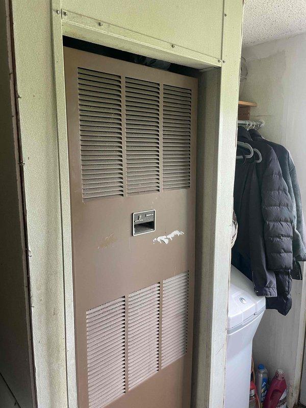 Conducted comprehensive HVAC system evaluation for manufactured home following home show appointment request. Assessed existing furnace installation located in interior closet utility space and exterior air conditioning components. Documented current equipment configuration including wall-mounted electrical service with temporary protective covering and conduit routing. Evaluated system compatibility and spatial requirements for complete furnace and air conditioning replacement. Prepared detailed quote for full HVAC system installation tailored to manufactured home specifications and existing infrastructure layout.