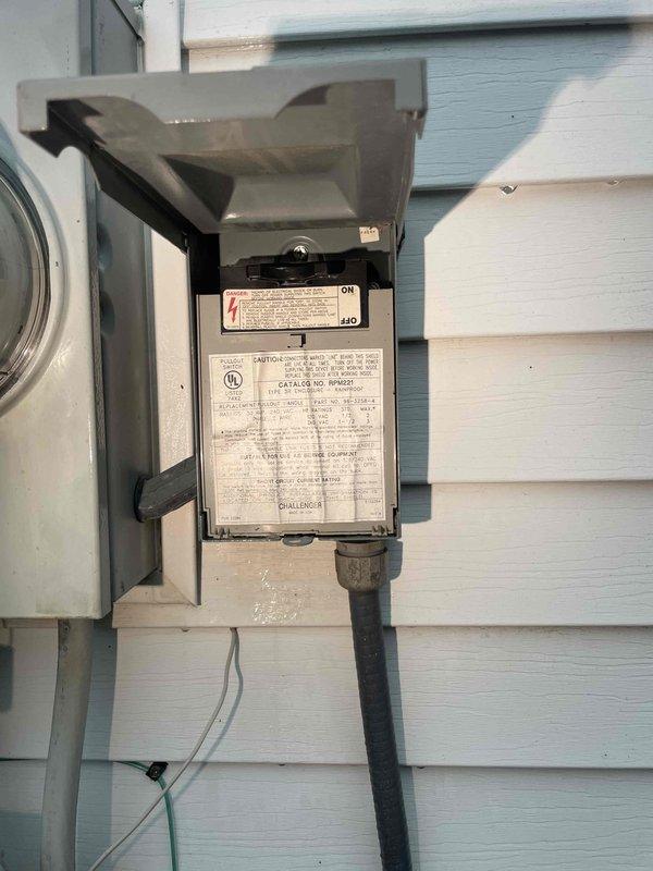 Provided comprehensive estimate for complete HVAC air conditioning system replacement at residential property with basement-located equipment. Existing 1994 unit is non-operational and requires full system replacement. Assessed exterior-mounted disconnect box, conduit routing, and existing HVAC equipment configuration to determine proper specifications for new installation.