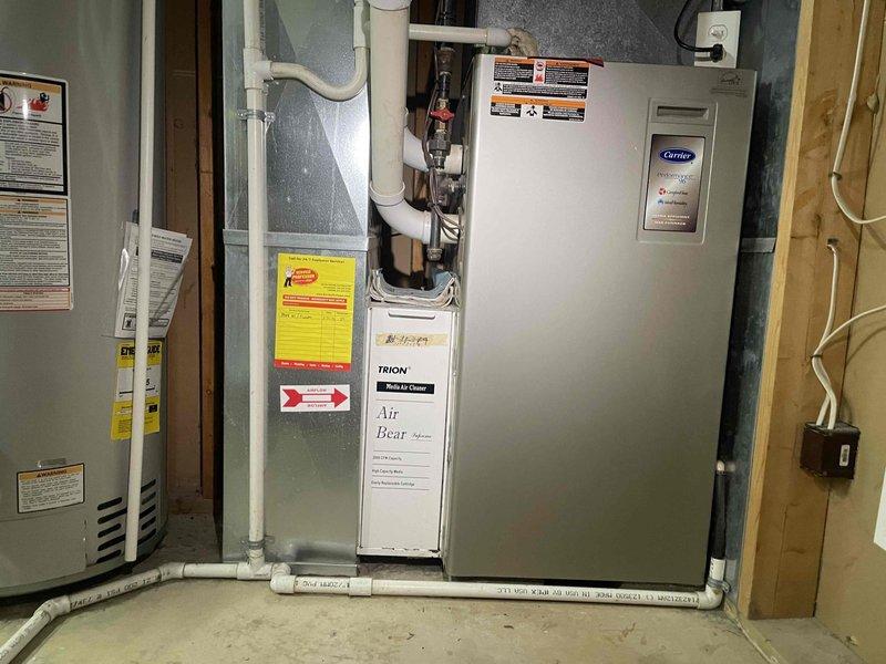 Provided comprehensive estimate for complete HVAC system replacement in basement location due to non-functional furnace with cracked heat exchanger. Assessed existing aged equipment configuration including furnace, air conditioning system, air handler with Air Bear filtration unit, and associated ductwork and drainage systems. Recommended full system replacement to address safety concerns from compromised heat exchanger and improve overall system efficiency and reliability.