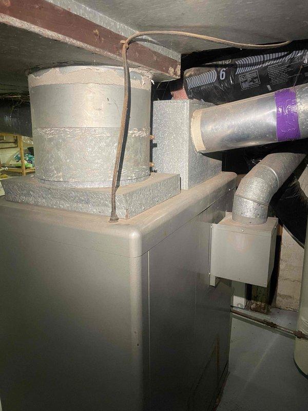 Provided comprehensive estimate for replacement of 20+ year old natural gas furnace located in basement. Current unit is non-operational and showing significant age-related wear and deterioration. Assessed existing HVAC installation including ductwork configuration, venting system, and equipment placement to determine optimal replacement options and specifications for new gas furnace system.