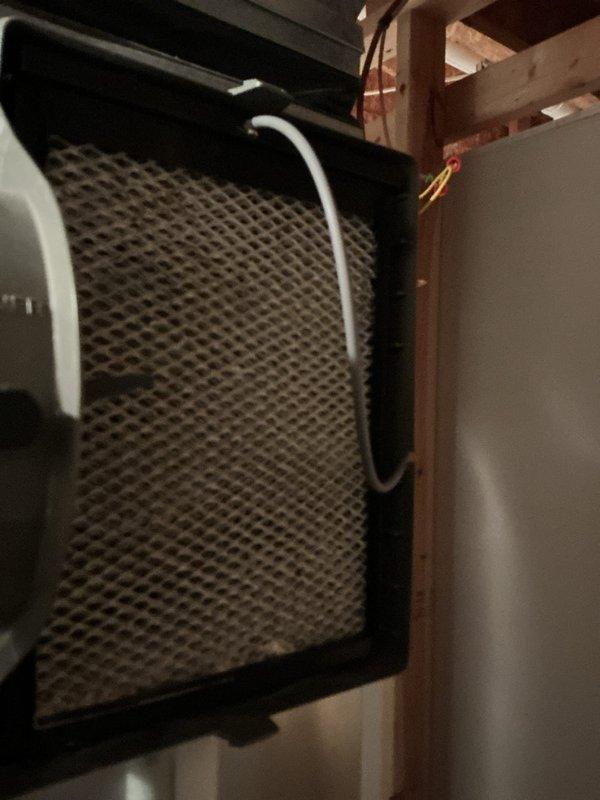 Completed annual HVAC maintenance inspection including filter evaluation and evaporator coil assessment. Filter showed visible debris accumulation and was documented; evaporator coil exhibited moisture condensation consistent with normal operation, with refrigerant lines and filter-drier component verified to be in proper working condition.